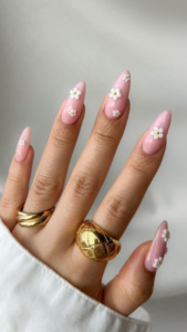 long almond shaped pink nails with white flowers