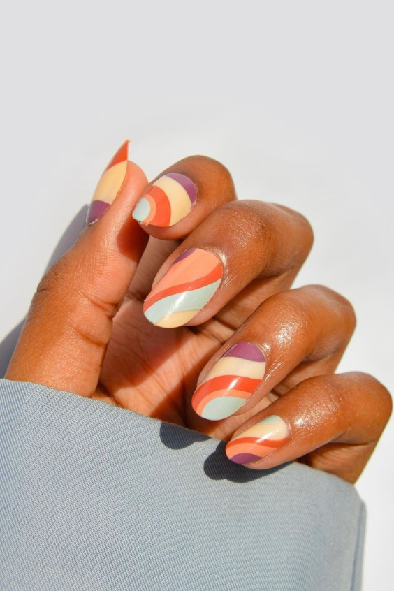 orange purple yellow swirly almond nails